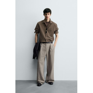 БРЮКИ ИЗ РЕЛЬЕФНОЙ ТКАНИ В ЕЛОЧКУ