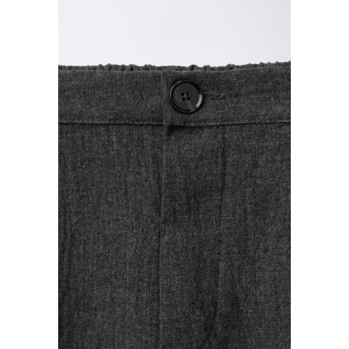 Текстурированные брюки с защипами