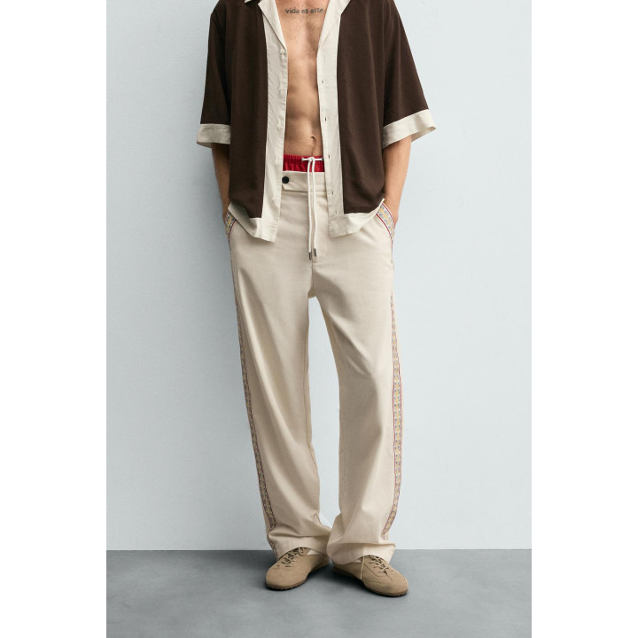 БРЮКИ С ВЫШИТЫМИ ЛАМПАСАМИ