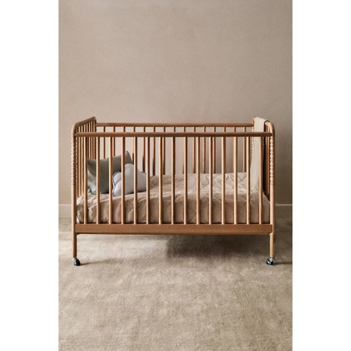 CARVED WOODEN COT WITH WHEELS