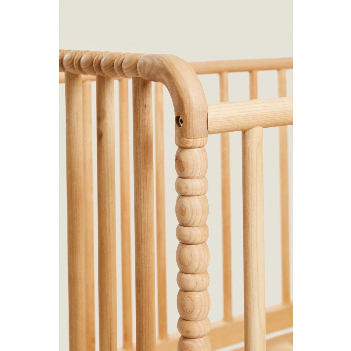 CARVED WOODEN COT WITH WHEELS