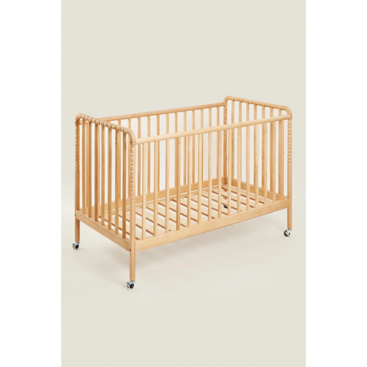 CARVED WOODEN COT WITH WHEELS