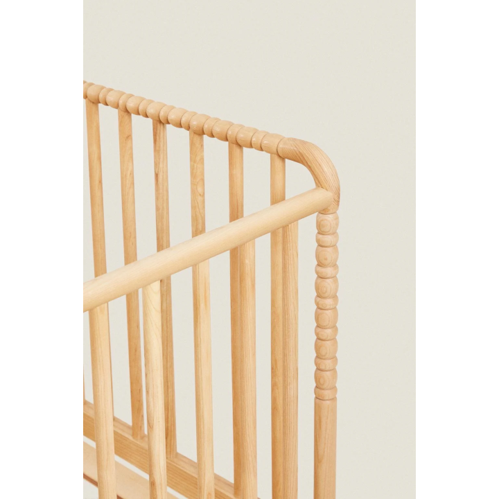 CARVED WOODEN COT WITH WHEELS