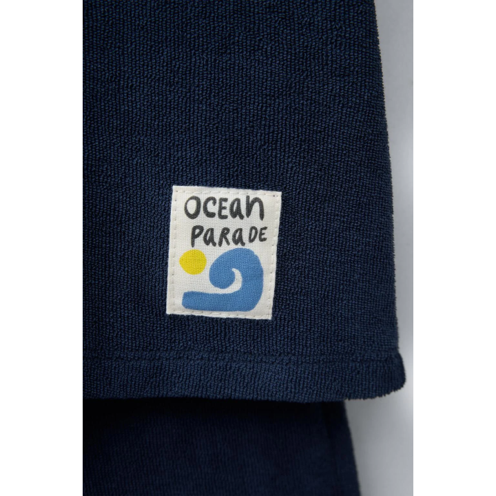 Комплект поло и бермуды из махровой ткани с лейблом