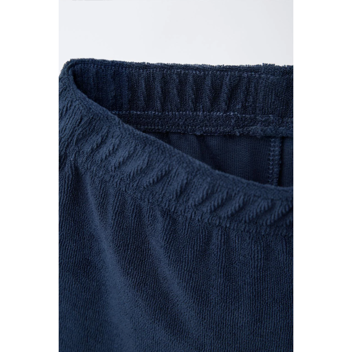 Комплект поло и бермуды из махровой ткани с лейблом