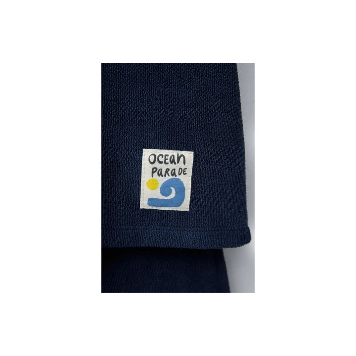 Комплект поло и бермуды из махровой ткани с лейблом