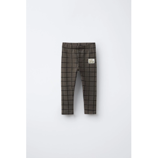 Брюки-леггинсы в клетку с деталями бренда