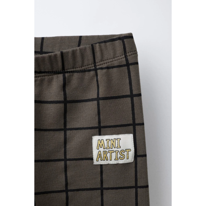 Брюки-леггинсы в клетку с деталями бренда