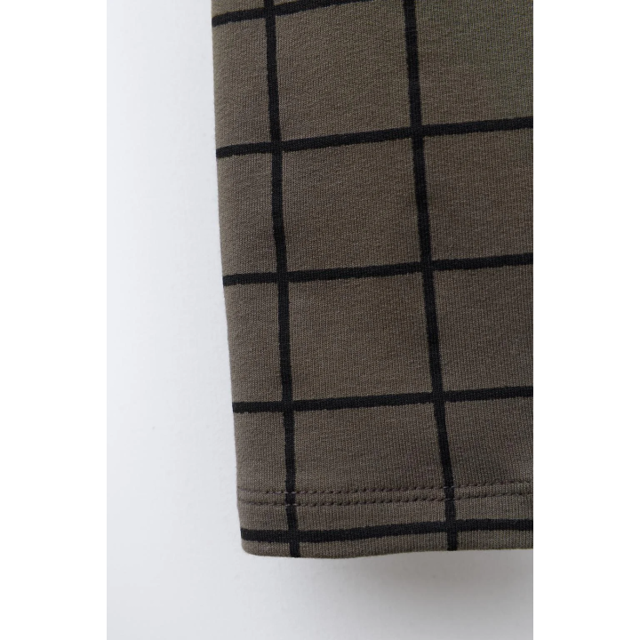 Брюки-леггинсы в клетку с деталями бренда