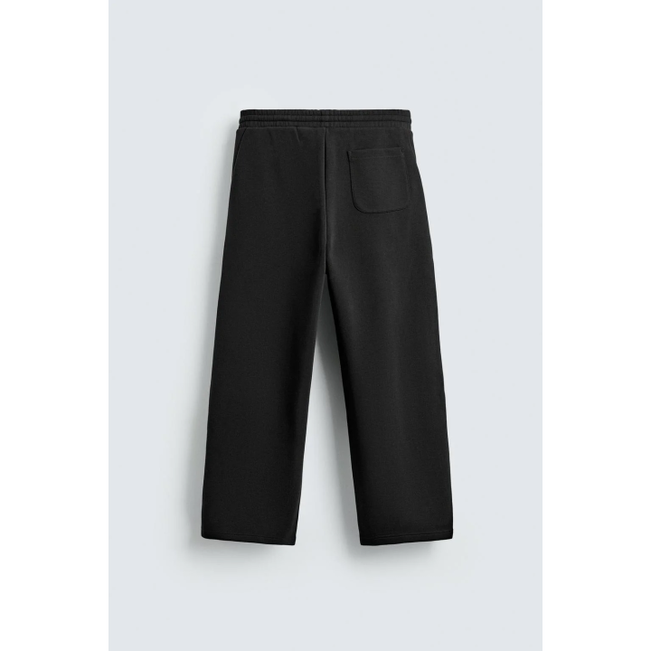 Брюки свободного кроя с плиссированными шарами эффекта неопрена