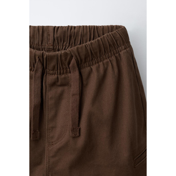 БРЮКИ ИЗ МЯГКОЙ ТКАНИ С КАРМАНАМИ