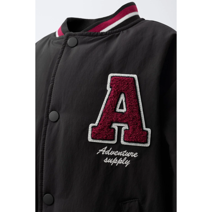 БОМБЕР С ПОДКЛАДКОЙ ИЗ ИСКУССТВЕННОЙ ОВЧИНЫ С НАШИВКОЙ