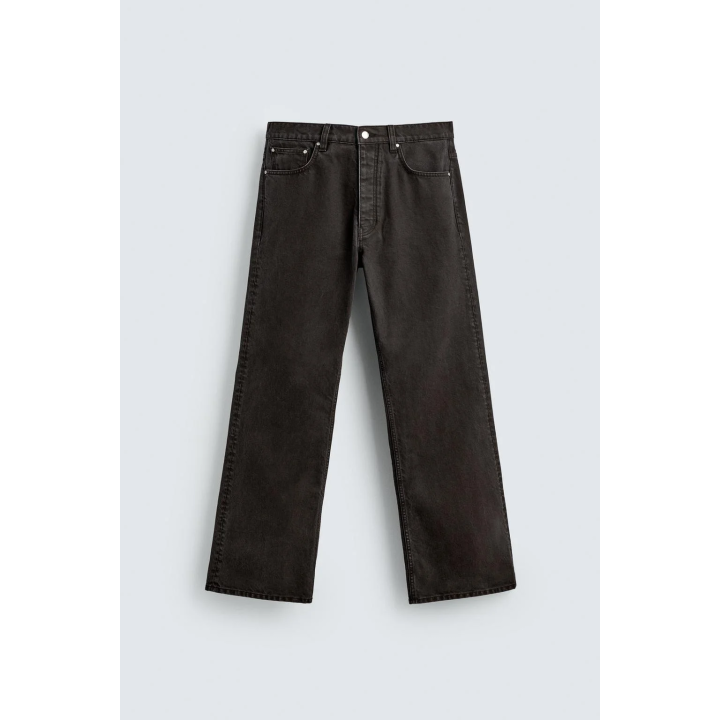 Джинсы с расклешенными штанинами и восковым покрытием