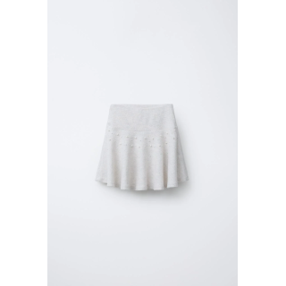 ЮБКА ИЗ МЯГКОЙ ТКАНИ С БУСИНАМИ