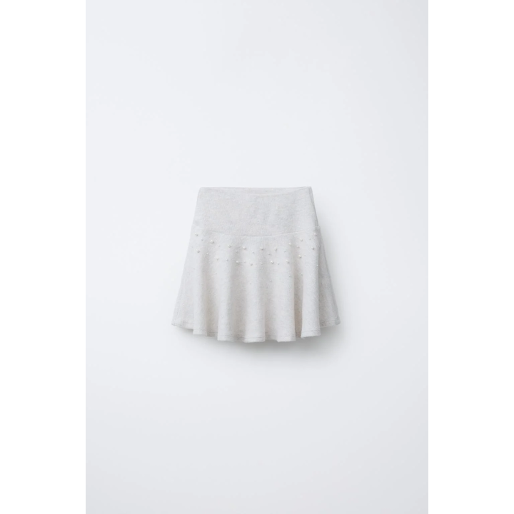 ЮБКА ИЗ МЯГКОЙ ТКАНИ С БУСИНАМИ