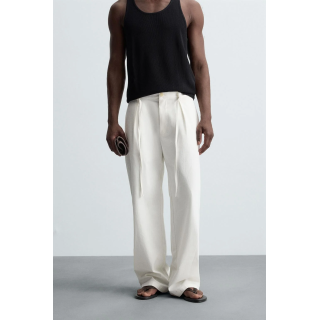 Брюки свободного кроя с защипами