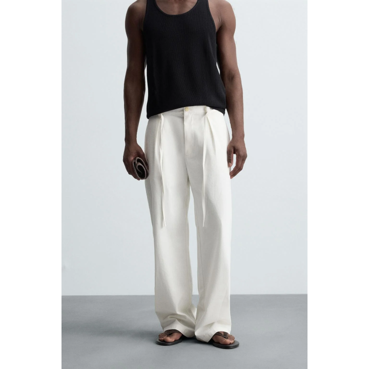 Брюки свободного кроя с защипами