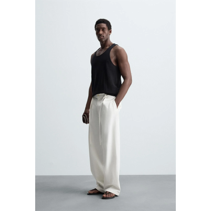 Брюки свободного кроя с защипами