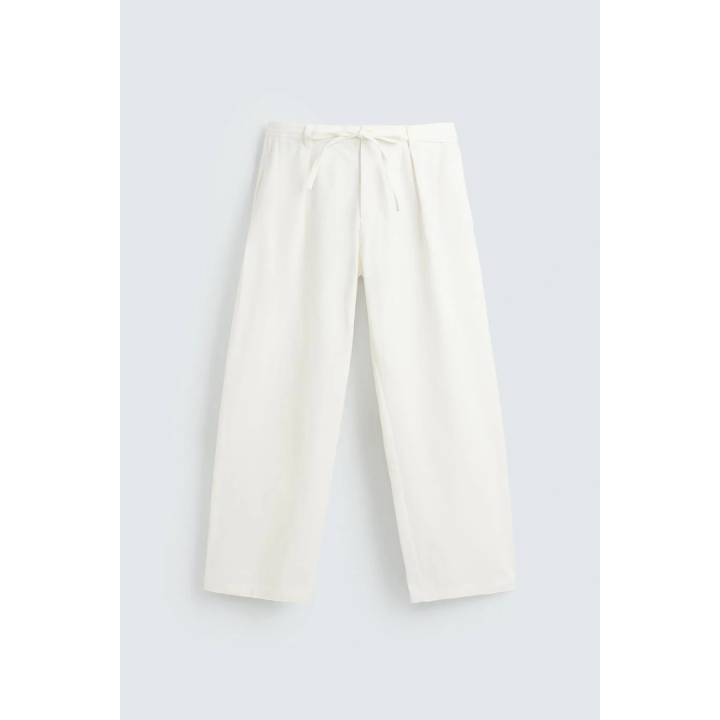 Брюки свободного кроя с защипами