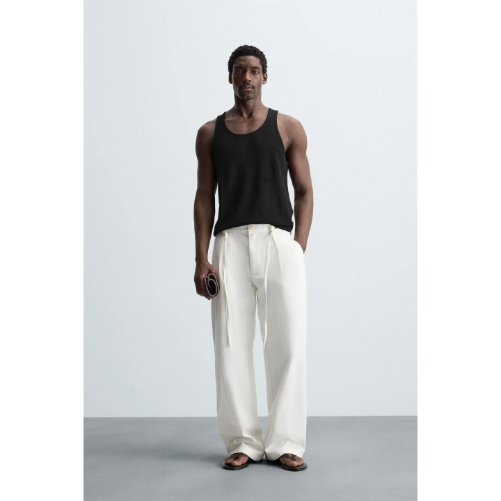 Брюки свободного кроя с защипами