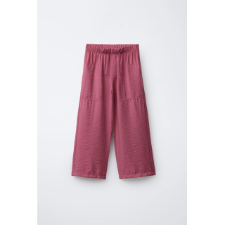 Брюки с эластичным поясом и аппликацией на пуговице