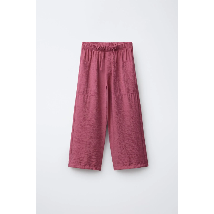 Брюки с эластичным поясом и аппликацией на пуговице