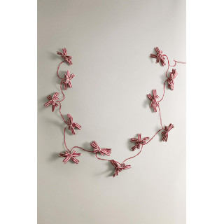 Рождественская гирлянда с огоньками и бантами