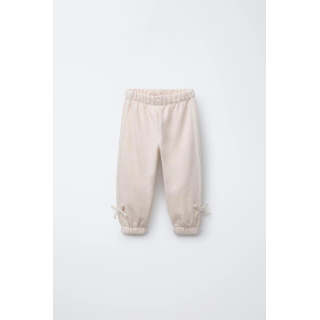 БРЮКИ-ДЖОГГЕРЫ С ЛАМПАСАМИ И БАНТОМ