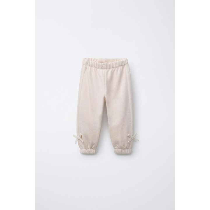 БРЮКИ-ДЖОГГЕРЫ С ЛАМПАСАМИ И БАНТОМ