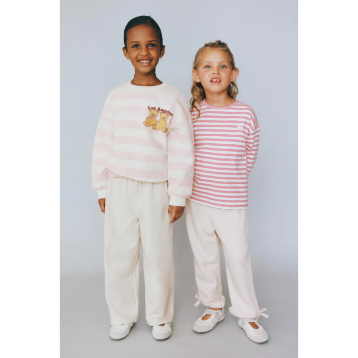 БРЮКИ-ДЖОГГЕРЫ С ЛАМПАСАМИ И БАНТОМ