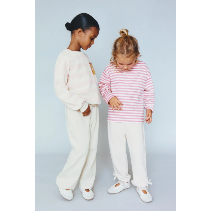 БРЮКИ-ДЖОГГЕРЫ С ЛАМПАСАМИ И БАНТОМ