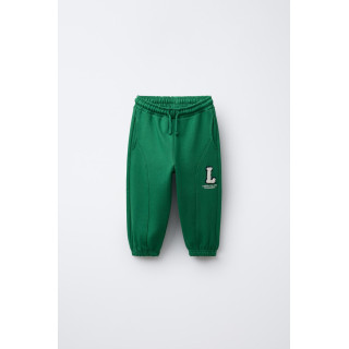 БРЮКИ-ДЖОГГЕРЫ С ЛОСКУТНОЙ ВСТАВКОЙ И РАЗРЕЗАМИ