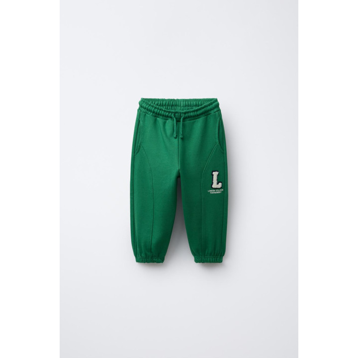 БРЮКИ-ДЖОГГЕРЫ С ЛОСКУТНОЙ ВСТАВКОЙ И РАЗРЕЗАМИ