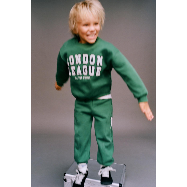 БРЮКИ-ДЖОГГЕРЫ С ЛОСКУТНОЙ ВСТАВКОЙ И РАЗРЕЗАМИ