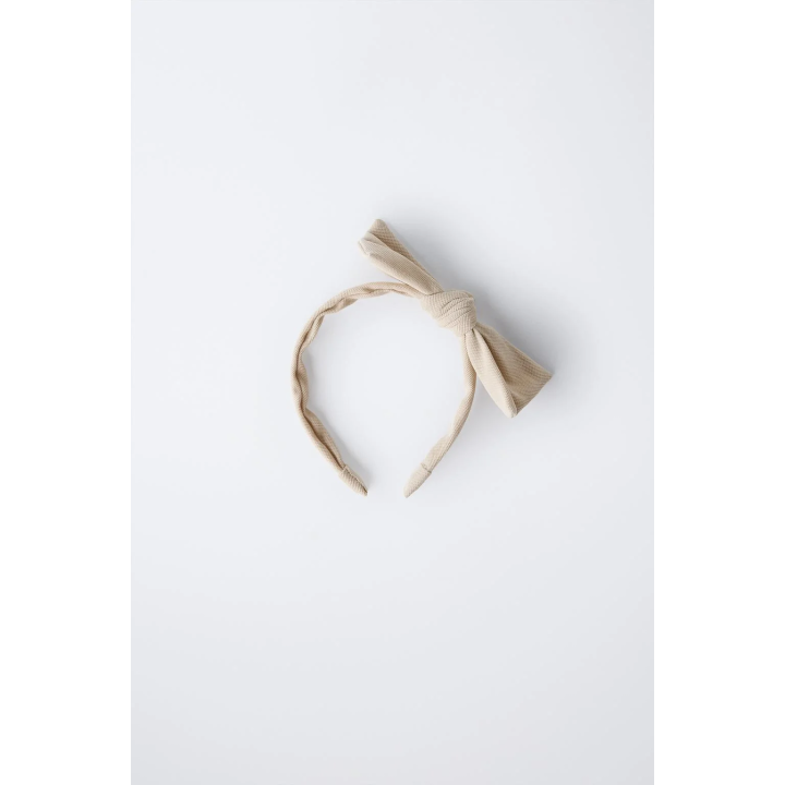 ОБОДОК С БАНТОМ ИЗ ТКАНИ ПИКЕ