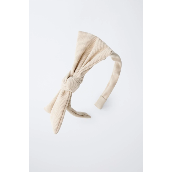 ОБОДОК С БАНТОМ ИЗ ТКАНИ ПИКЕ