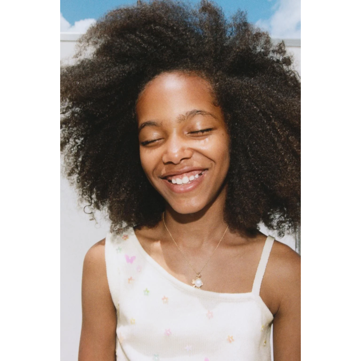 ТРИКОТАЖНЫЙ ТОП С АСИММЕТРИЧНЫМ ВЫРЕЗОМ И БУСИНАМИ