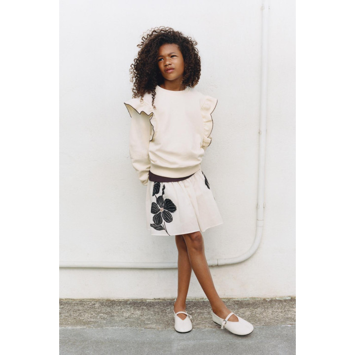 ТОЛСТОВКА С ВОЛАНАМИ И ОТСТРОЧКОЙ