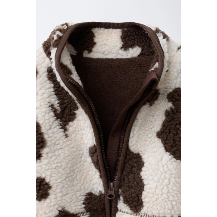 КУРТКА ИЗ ИСКУССТВЕННОЙ ОВЧИНЫ С КОРОВЬИМ ПРИНТОМ