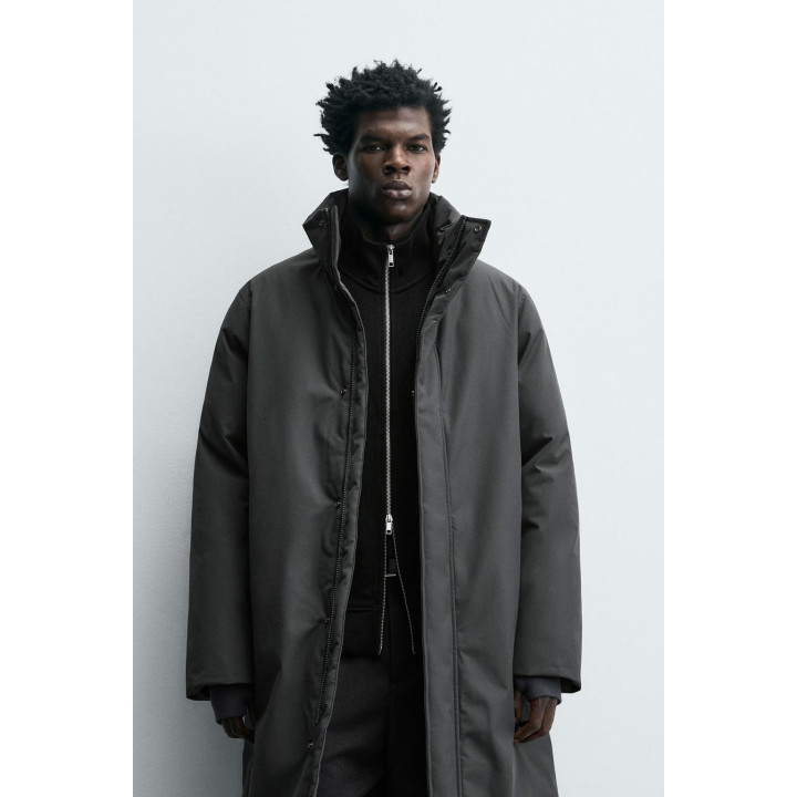 Длинный стеганый пуховик