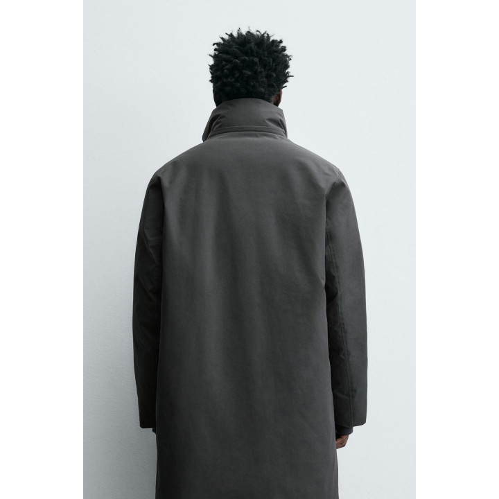 Длинный стеганый пуховик