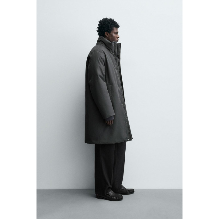 Длинный стеганый пуховик