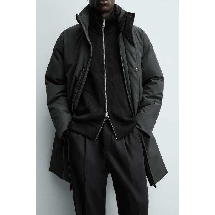 Длинный стеганый пуховик