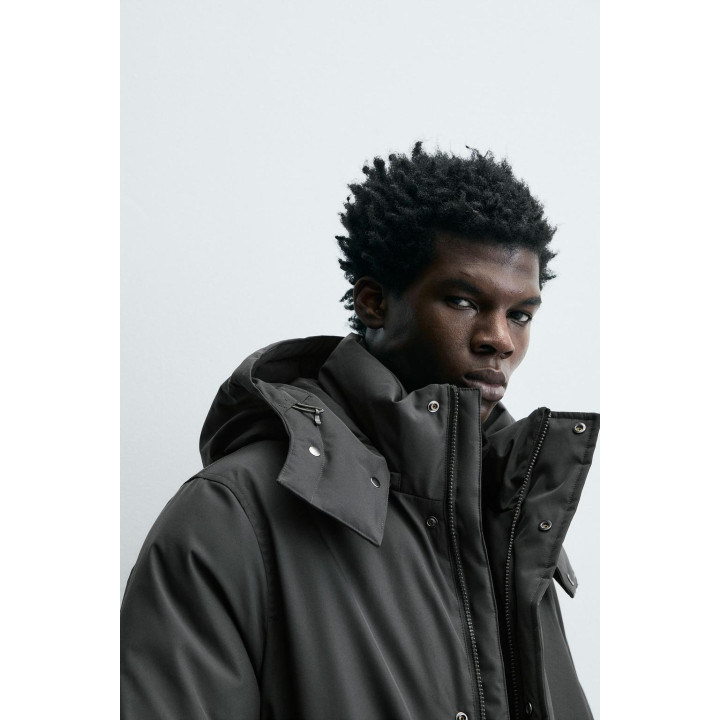 Длинный стеганый пуховик