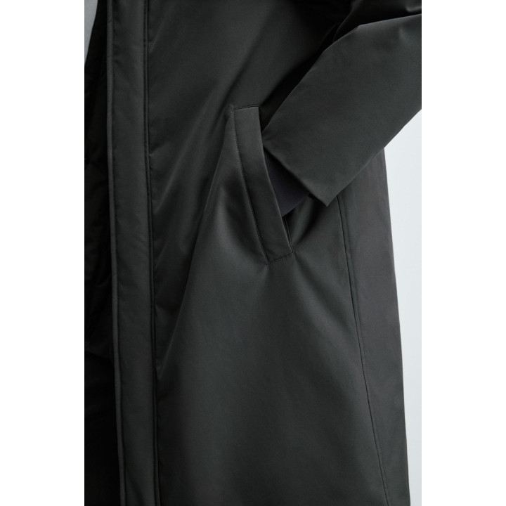 Длинный стеганый пуховик