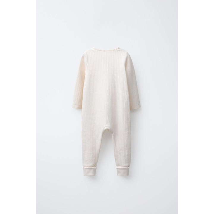 КОМБИНЕЗОН С РЕГУЛИРУЕМЫМИ ШТАНИНАМИ И V-ОБРАЗНЫМ ВЫРЕЗОМ