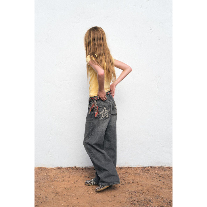ДЖИНСЫ WIDE LEG СО ЗВЕЗДАМИ И АНИМАЛИСТИЧЕСКИМ ПРИНТОМ