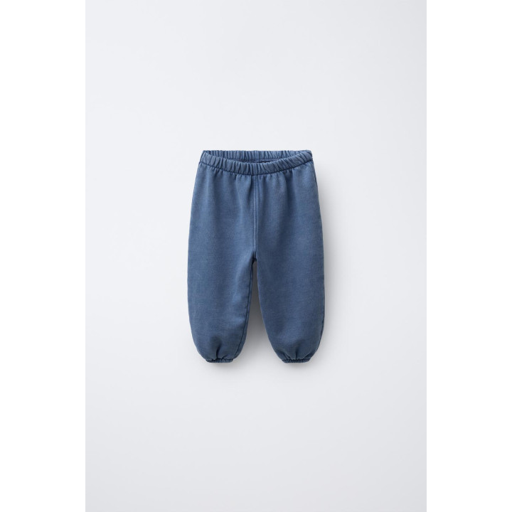 БРЮКИ-ДЖОГГЕРЫ С ЭФФЕКТОМ ПОТЕРТОСТИ