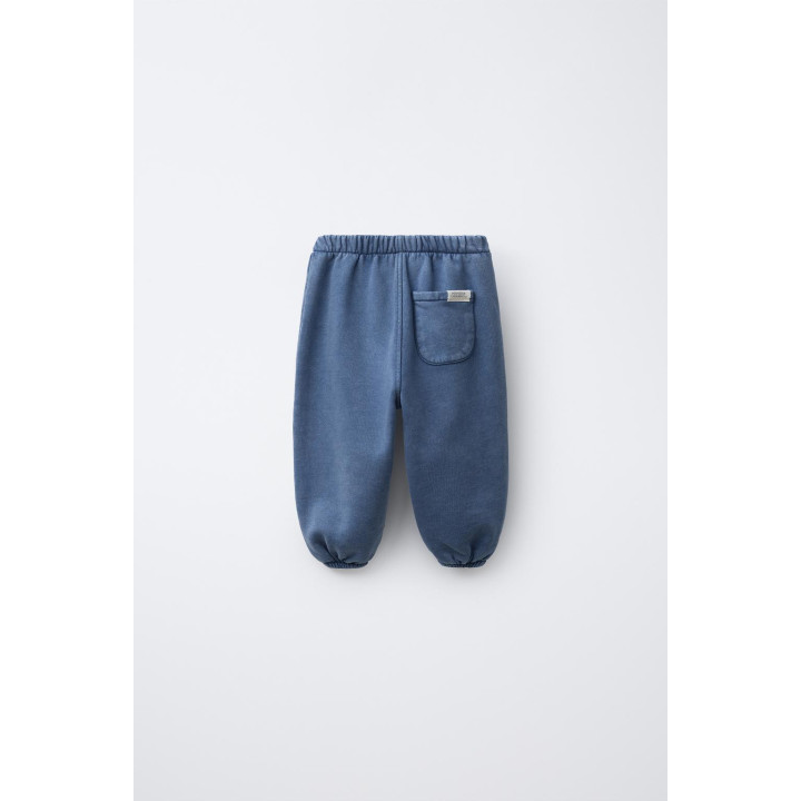 БРЮКИ-ДЖОГГЕРЫ С ЭФФЕКТОМ ПОТЕРТОСТИ