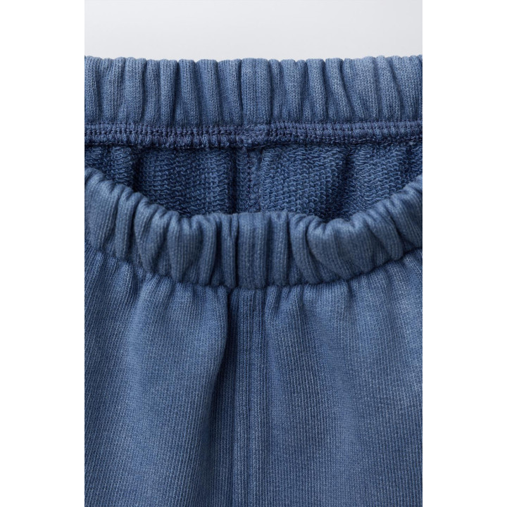 БРЮКИ-ДЖОГГЕРЫ С ЭФФЕКТОМ ПОТЕРТОСТИ